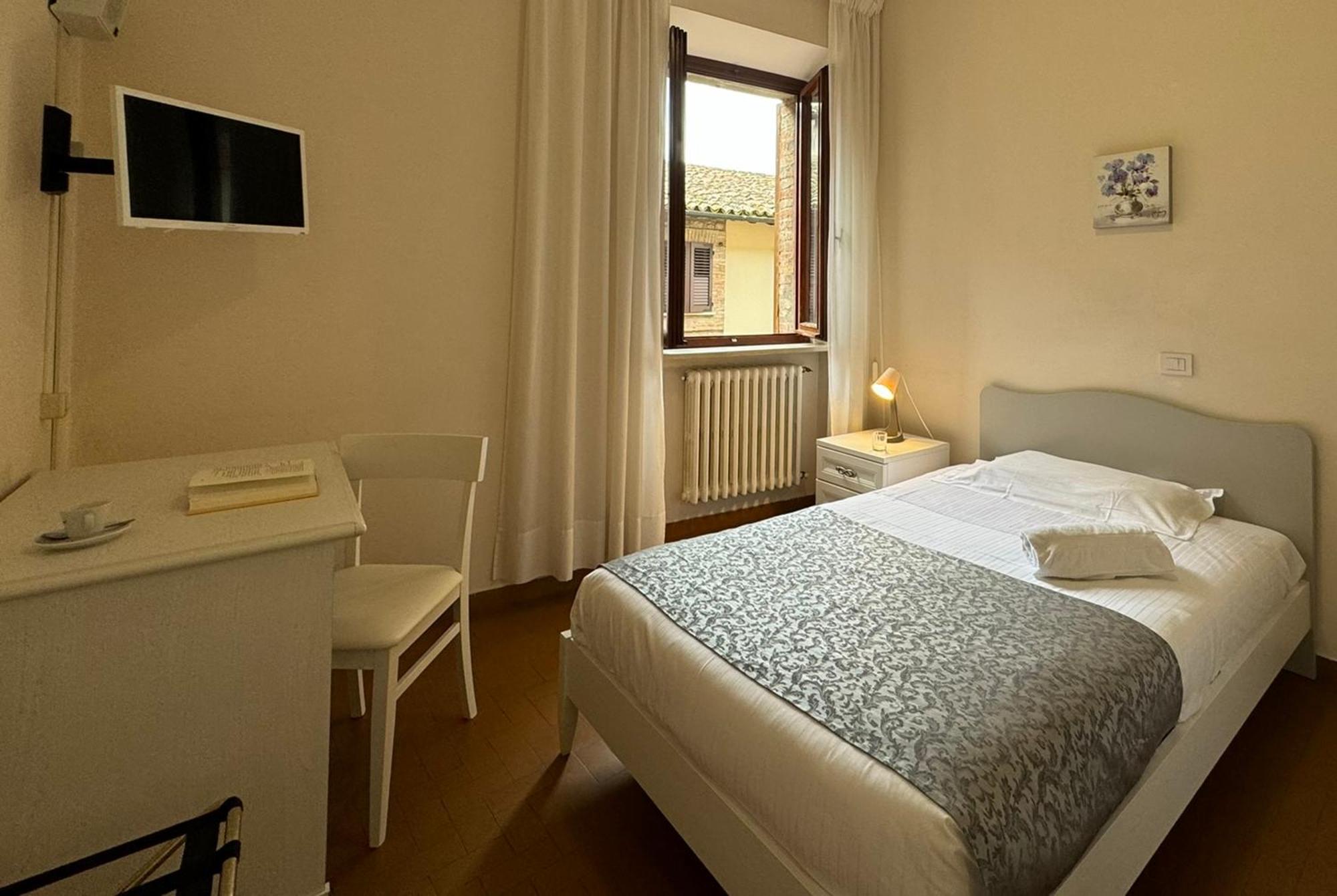 Hotel Monastero SS. Annunziata Todi Esterno foto A room at the hotel