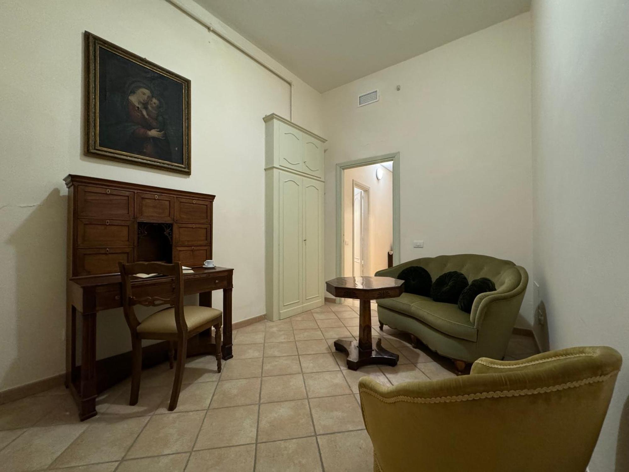 Hotel Monastero SS. Annunziata Todi Esterno foto The living room of the apartment